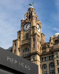 Pier Head Sign and the Royal Liver Building in Liverpool, UK