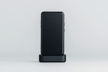 Naklejka premium Sleek smartphone positioned on minimalistic charging dock, showc