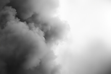 Fototapeta premium Thick Smoke Cloud in Monochrome, Evoking Mystery and Atmosphere A thick cloud of smoke in a monochrome color scheme envelops the frame, creating an intense, atmospheric scene. Idea