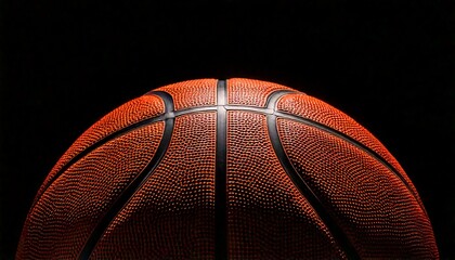 Basketball with glowing yellow light on a reflective surface