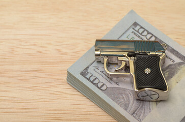 The Intersection of Power and Wealth: Gun and Money Symbolizing Corruption and Criminal Activity