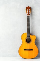 Fototapeta premium Classic acoustic guitar displayed against a gray wall with vibrant orange soundwave graphics