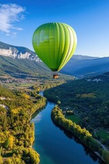 Naklejka premium Colorful hot air balloon soaring over a picturesque landscape at sunrise, capturing the spirit of adventure and freedom.