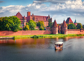 Gorgeous summer cityscape of Malbork town on the Nogat River, Pomeranian Voivodeship,  Poland,...