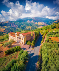 Vertical summer view from flying drone of typical Italian church, Bonifati village location,...