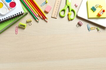 Flat lay with school stationery on wooden background, top view © Sunlight