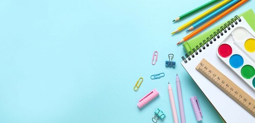 Flat lay with colorful stationery on colo background, top view
