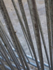 Close-Up View of Metal Bars with a Background of Blurred Surface