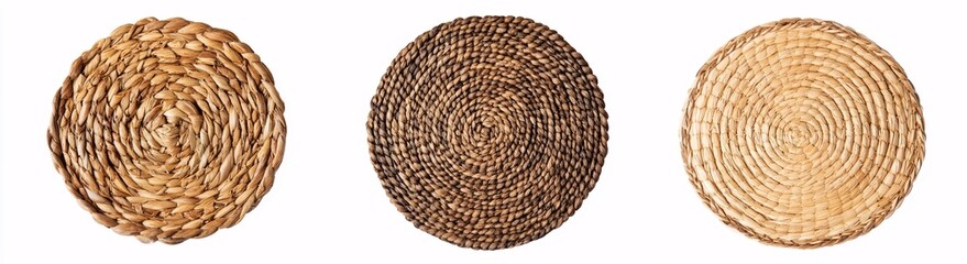 Obraz premium Three natural woven straw placemats in varied brown tones on white background