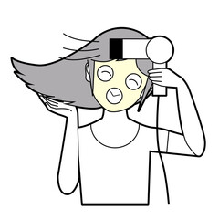 フェイスマスクをしながらブローする女性