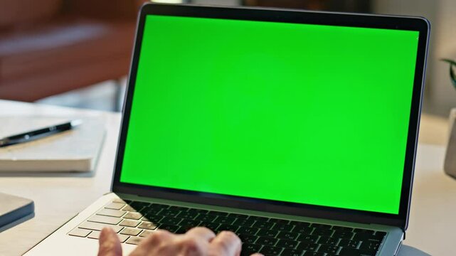 Manager fingers scrolling chromakey laptop touchpad working at cozy home closeup