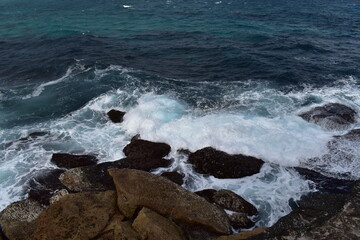 waves crashing on rocks