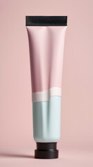A photograph of a cylindrical, pastel-colored beauty product tube with a black cap, set against a soft pink background. 