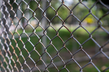 Close-up chain link fence , Sunset background