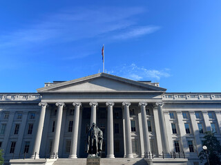 Department of the Treasury building and Albert Gallatin statue in Washington DC. Government Building in Washington DC.
