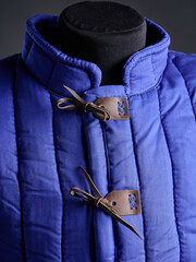 Historical fashion. Medieval knight cloth. Padded jacket gambeson.