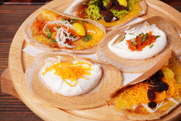 Thai desserts Thai Crispy Pancake (Kanom Buang)placed on a woode