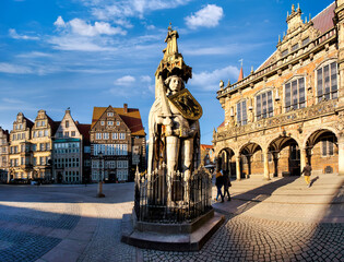 The famous Bremen Roland statue on the marketplace in Bremen, surrounded by ornate historic...
