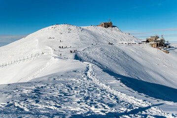 Tatra mountains at winter time. View of the white snow-capped peaks, frosty winter mountains. Kasprowy Wierch, High Tatra, Poland, Europe.