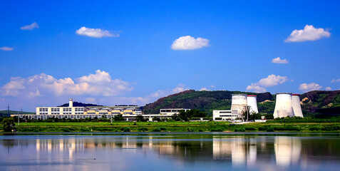 Landscape with the Thermal Power Plant in the city of Iernut, Mures County - Romania, reflected in the lake water