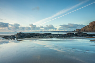 Druidston Haven Beach on the Pembrokeshire coast in Wales, with reflections