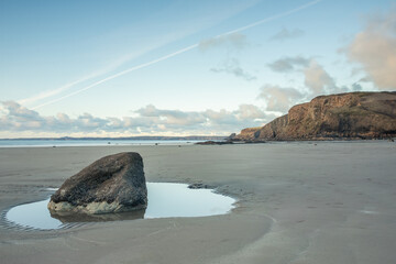 Druidston Haven Beach on the Pembrokeshire coast in Wales, with reflections