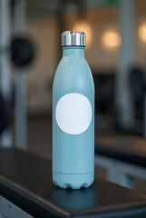 MOCKUP - blank sticker on a water bottle placed on a gym bench