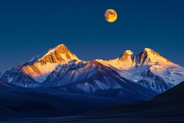 Majestic sunrise over kailash mountain range illuminated by golden light and moonlit sky