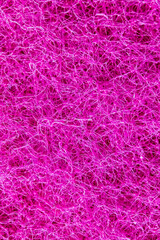 Close-up of a pink coloured dishwashing sponge