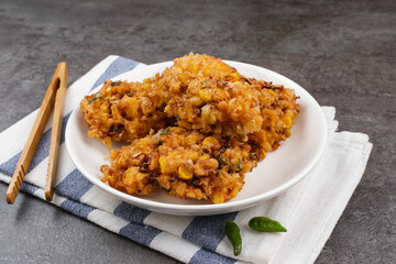 Perkedel Jagung or Bakwan Jagung, corn fritters made from corn, egg and flour. Indonesian food
