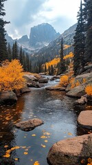 Autumnal stream flows through mountain valley