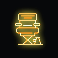 Bright yellow neon sign of folding camp chair with footrest glowing on black background