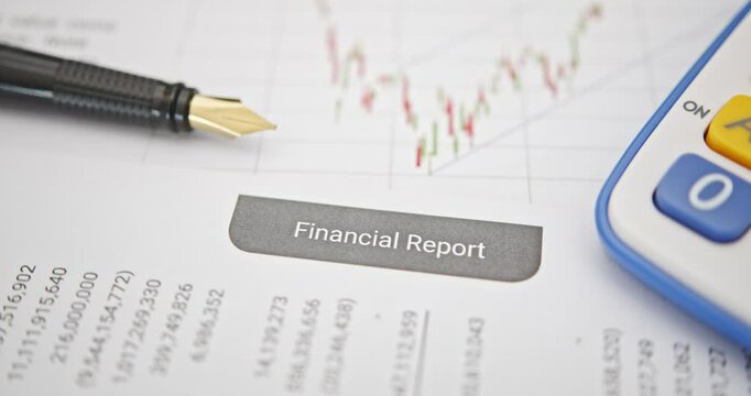 Analyzing financial reports: Tools for informed decision-making. A pen, a calculator on a financial report, depicting essential tools for financial analysis, the process of evaluating financial data.