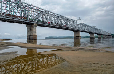 Train traffic. Railway bridge and trains with wagons. Transportation industry	

