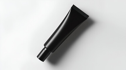 Fototapeta premium Sleek black cosmetic tube on white background. Perfect for product packaging design mockups.