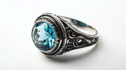 A close-up of an elegant silver ring with a large gemstone, placed on a white isolated background
