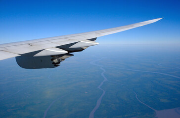 Boeing 747-800 wing and engine in the cruise, at altitude