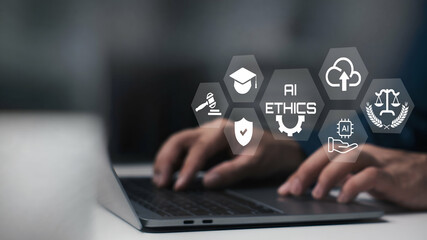 A person using laptop on AI ethics or AI law concept with visual screen.