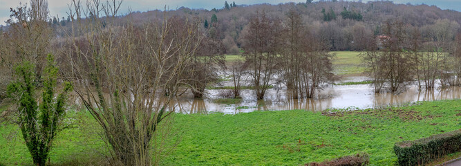 Obraz premium Normandy, France, Europe : Exterior photo view water floods due to climate change in fields creating damage disaster in agriculture environement