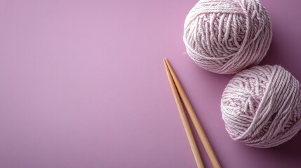 Knitting Needles and Yarn on Solid Background 