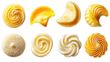 Various swirls of yellow and white frosting isolated on black
