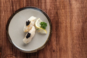 White Fish Sushi with Caviar Served on a Plate