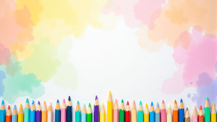 Obraz premium A vibrant array of colored pencils arranged neatly against a soft pastel backdrop.