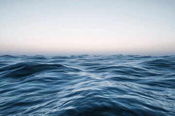 Obraz premium Sunset over calm ocean waters creates a serene atmosphere with vibrant colors on the horizon