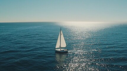 Obraz premium Sailboat on Open Water Sunlight Reflecting