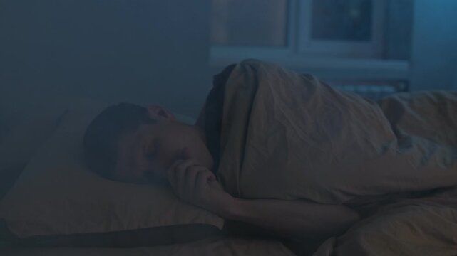 Man suffocates in bed, smoke fills the room, house fire.