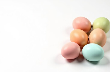 In the right are eggs, with free space for text on the left of image, pastel colors eggs, pattern on the eggs, white background.