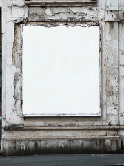 A blank white A2 format poster on an outdoor advertising board in the city, street photography, worn edges and peeling paint.