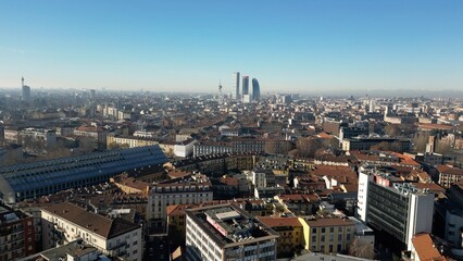 Europe, Italy, Milan 01,30,2025 drone aerial view of Garibaldi Railway station , arrive in  Milan fashion city downtown with Frecciarossa train  
