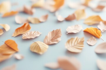 Scattered leaves in vibrant autumn colors cover a textured surface, casting soft shadows. The warm hues create a cozy, inviting atmosphere perfect for seasonal decor